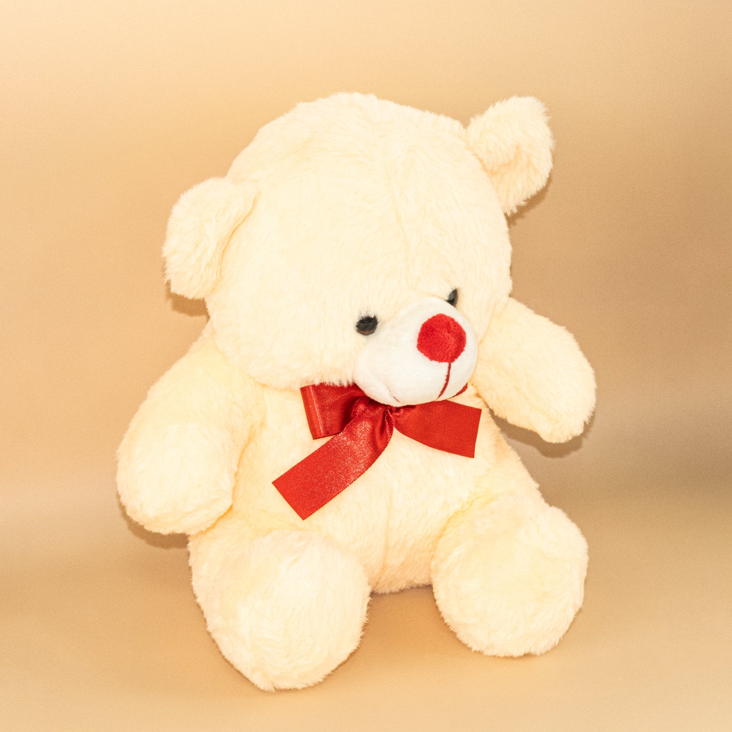 Peach Teddy Bear with Red Bow