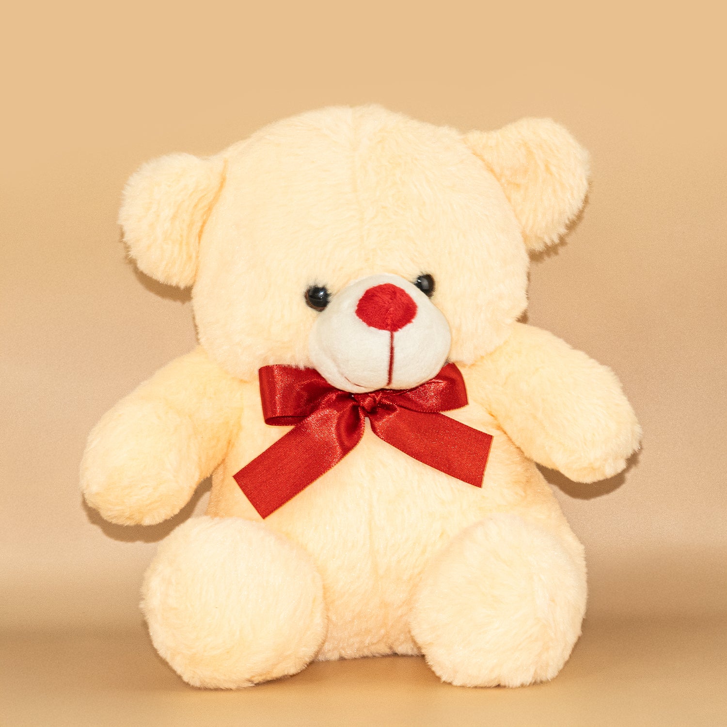 Peach Teddy Bear with Red Bow